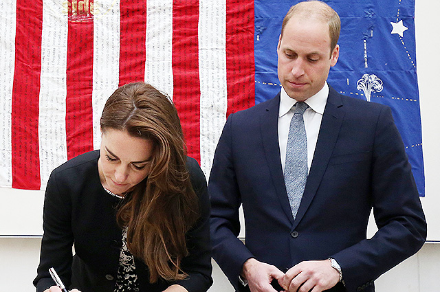 LONDON, ENGLAND - JUNE 14: Catherine, Duchess of Cambridge signs a book of condolence for the Orlando mass shooting victims while Prince WIlliam, The Duke of Cambridge looks on at the US Embassy on June 14, 2016 in London, England. (Photo by Philip Toscano - WPA Pool/Getty Images)
