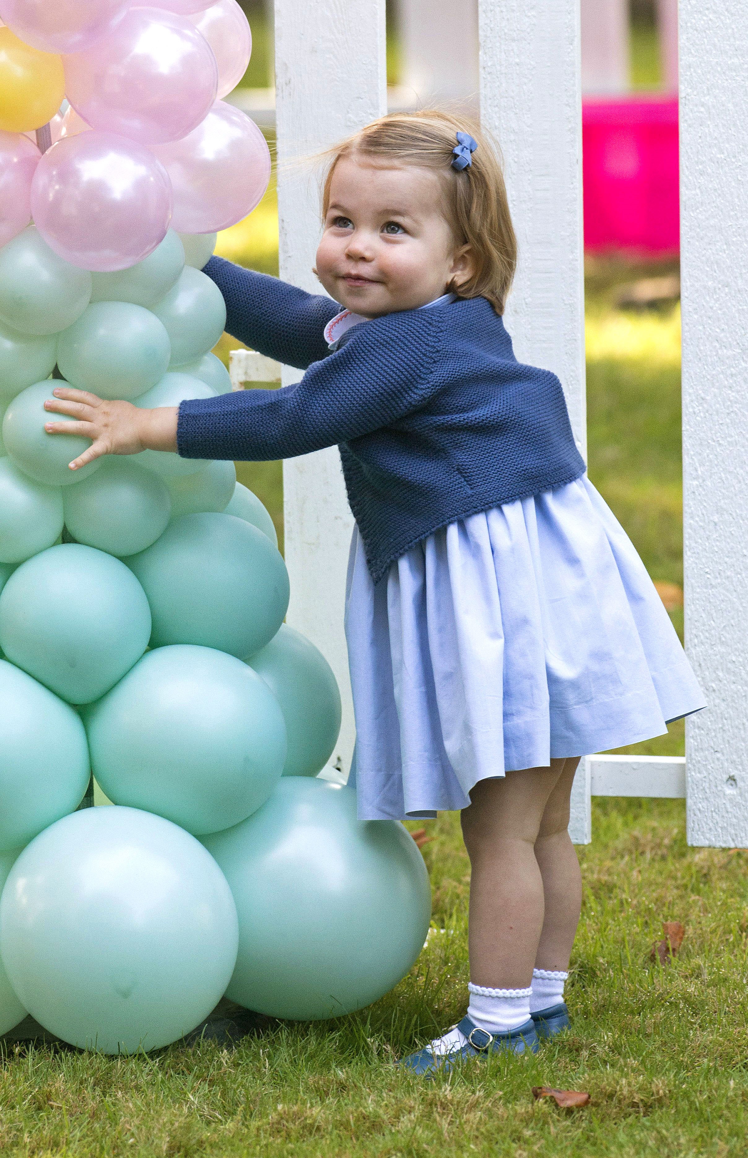 Mandatory Credit: Photo by Francis Dias/NEWSPIX/REX/Shutterstock (6047577ax) Princess Charlotte at a children's party for military families, Government House, Victoria, British Columbia The Duke and Duchess of Cambridge visit Canada - 29 Sep 2016 Royals attend children's party for military families, Government House, Victoria WEARING MI LUCERO cardigan UFO Mary Jane shoes, bow by Amaia Kids, smocked dress by Pepa & Co